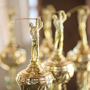 Victorious cups on golf. Cups of winners on golf. Game golf.